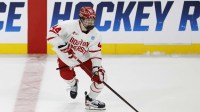 Boston University defenseman Cole Hutson (44) skates with the puck in the third period against the Cornell at Huntington Center.