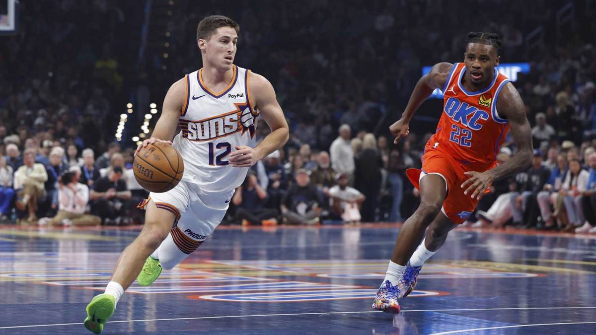 Phoenix Suns guard Collin Gillespie (12) drives to the basket around Oklahoma City Thunder guard Cason Wallace (22) during the first quarter at Paycom Center.