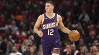 Phoenix Suns guard Collin Gillespie (12) dribbles the ball during the fourth quarter against the Houston Rockets at Toyota Center.