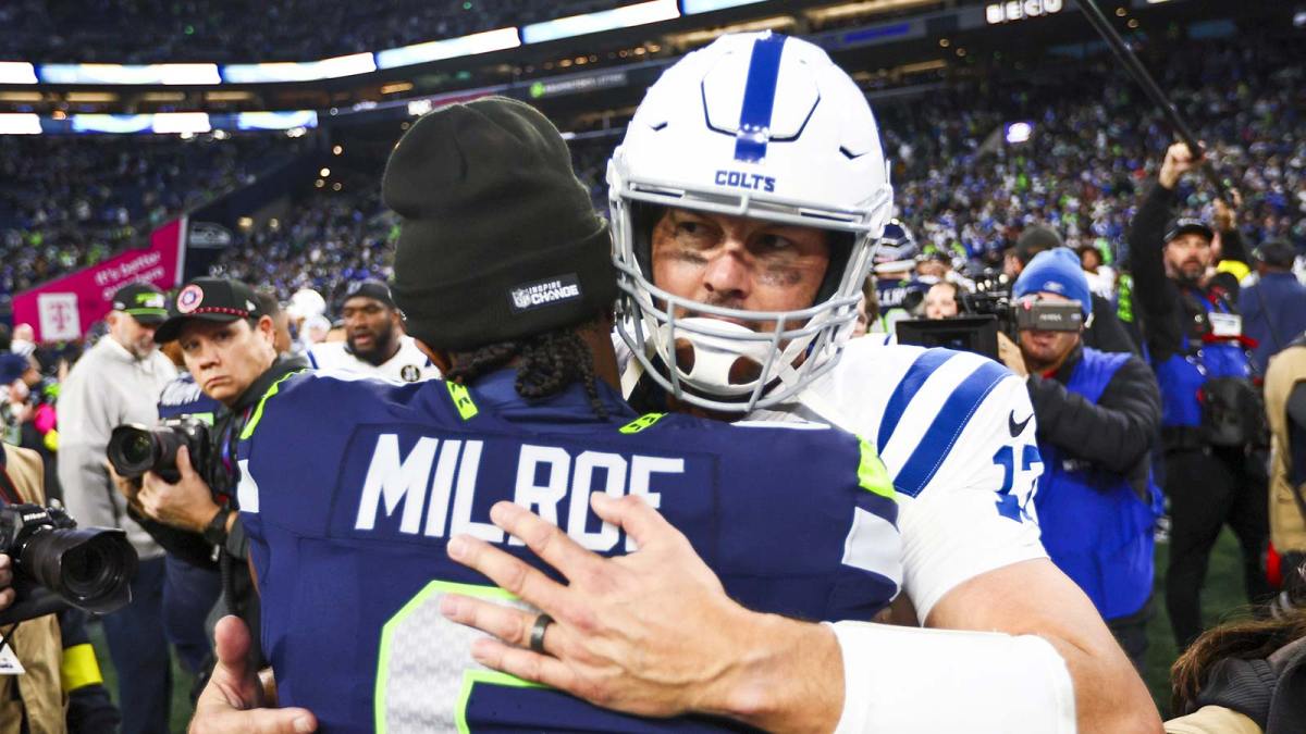 Indianapolis Colts quarterback Philip Rivers (17) hugs Seattle Seahawks quarterback Jalen Milroe (6) following a victory by the Seattle Seahawks at Lumen Field.