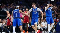 Dallas Mavericks forward Cooper Flagg (32) celebrates with Dallas Mavericks guard Ryan Nembhard (9) after scoring during the fourth quarter against the Miami Heat at American Airlines Center.