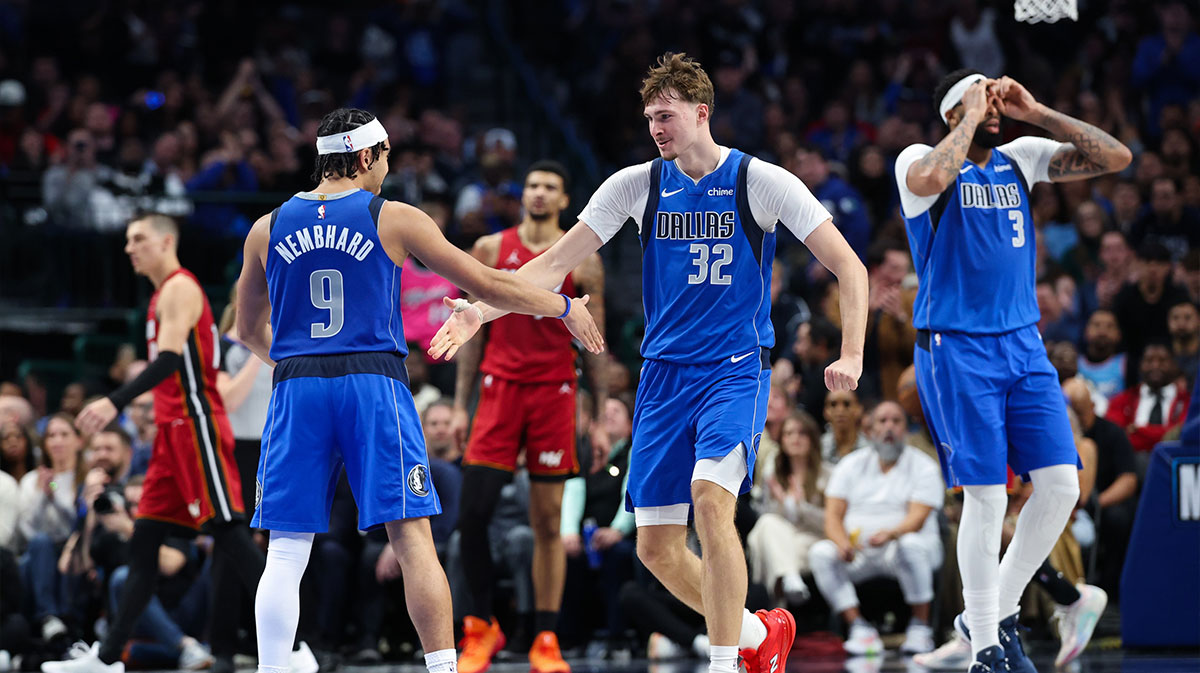 Dallas Mavericks forward Cooper Flagg (32) celebrates with Dallas Mavericks guard Ryan Nembhard (9) after scoring during the fourth quarter against the Miami Heat at American Airlines Center.