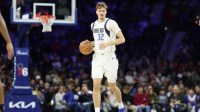 Dallas Mavericks forward Cooper Flagg (32) dribbles the ball against the Philadelphia 76ers during the second quarter at Xfinity Mobile Arena.