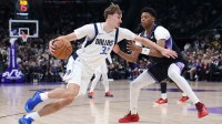 Dallas Mavericks forward Cooper Flagg (32) drives to the basket against Utah Jazz guard Ace Bailey (19) during the second quarter at Delta Center.