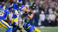Los Angeles Rams safety Kam Curl (3) forces a fumble against Seattle Seahawks wide receiver Cooper Kupp (10) in the first half at Lumen Field.