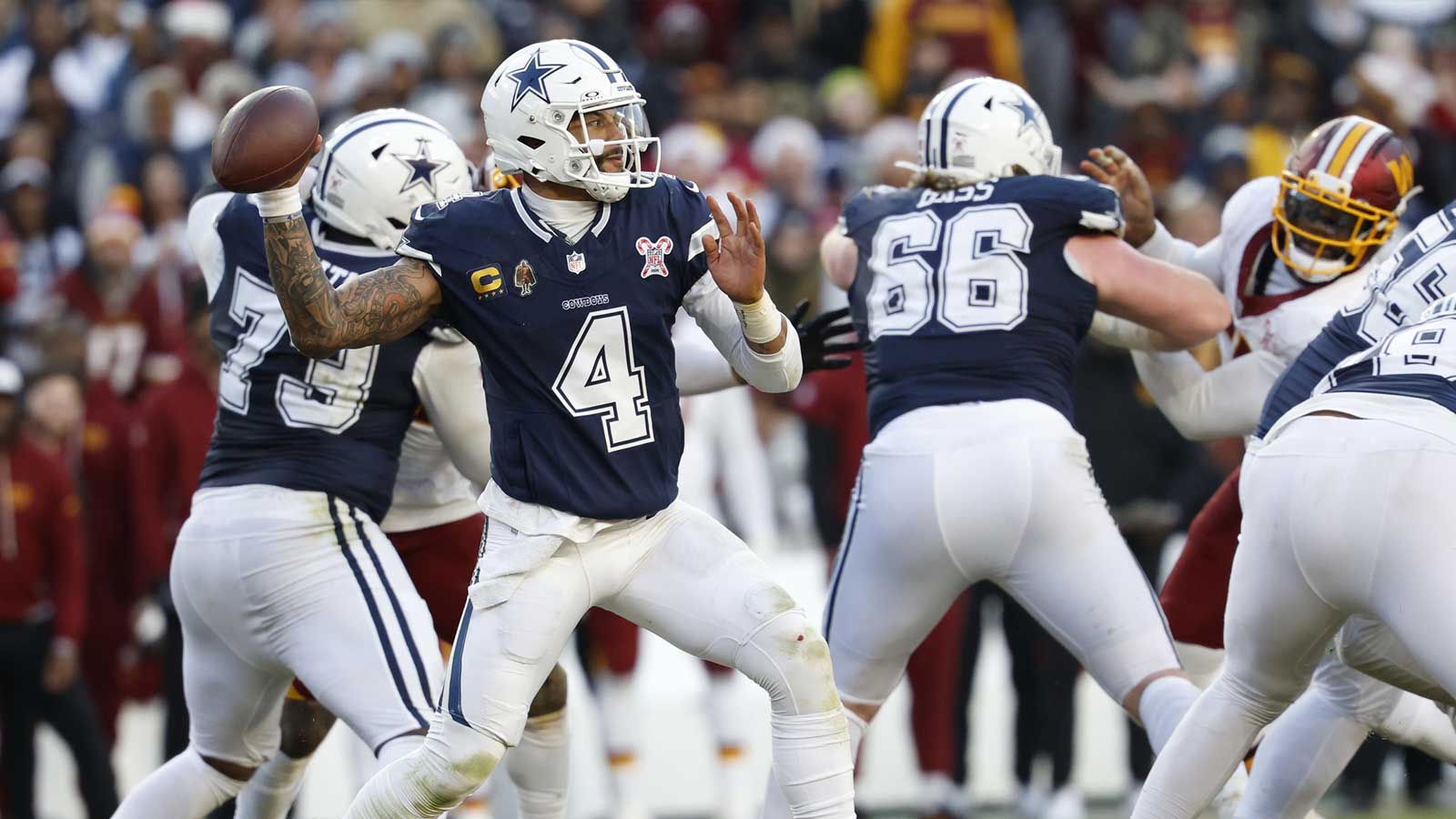Dallas Cowboys quarterback Dak Prescott (4) passes the ball against the Washington Commanders during the second half at Northwest Stadium.