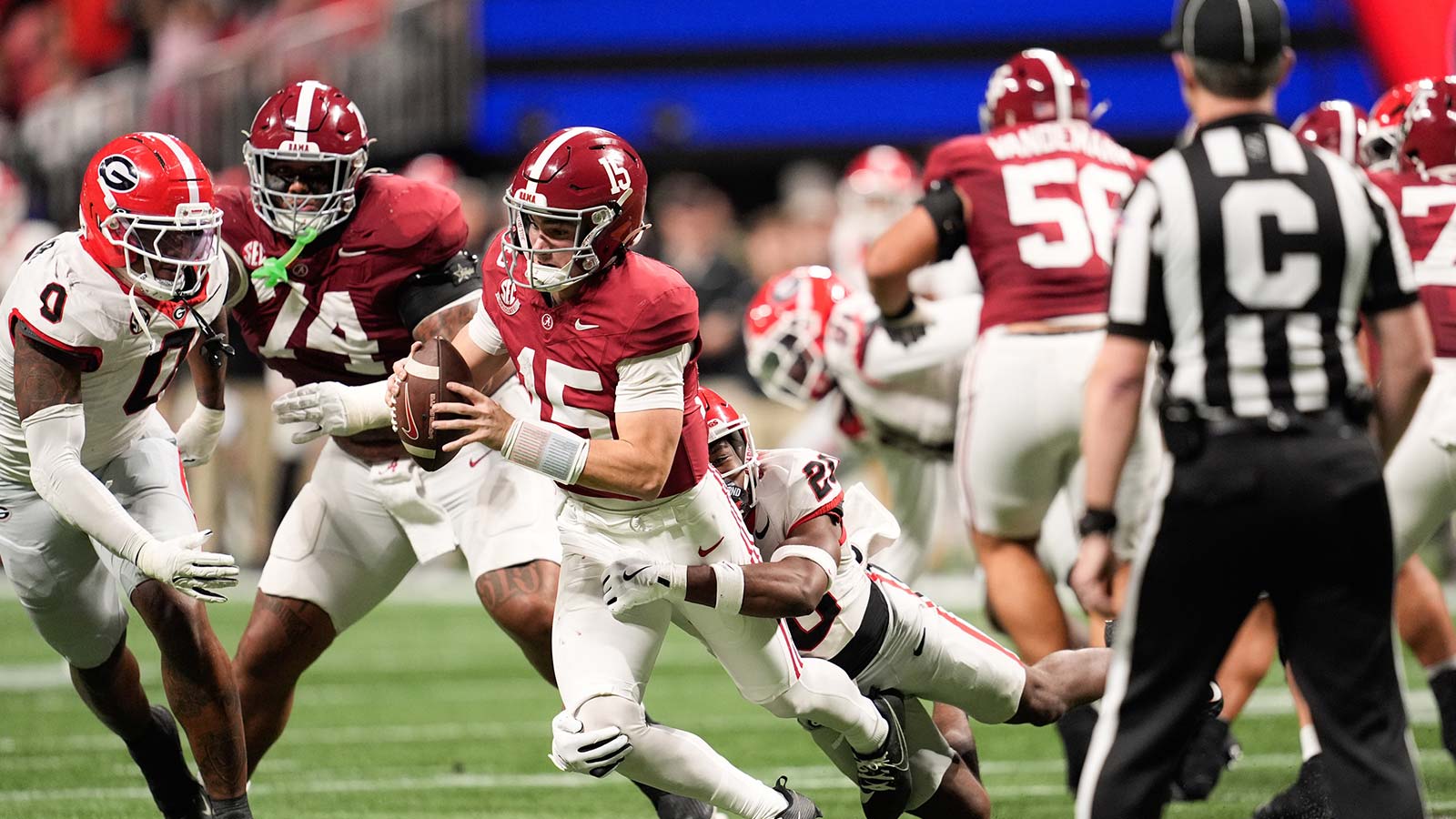 Alabama Crimson Tide quarterback Ty Simpson (15) is sacked by Georgia Bulldogs defensive back Jacorey Thomas (20) during the third quarter during the 2025 SEC Championship game at Mercedes-Benz Stadium.