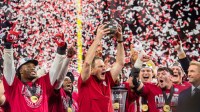 Indiana Head Coach Curt Cignetti and the Hoosiers celebrate after the Indiana versus Ohio State Big Ten Championship football game at Lucas Oil Stadium.