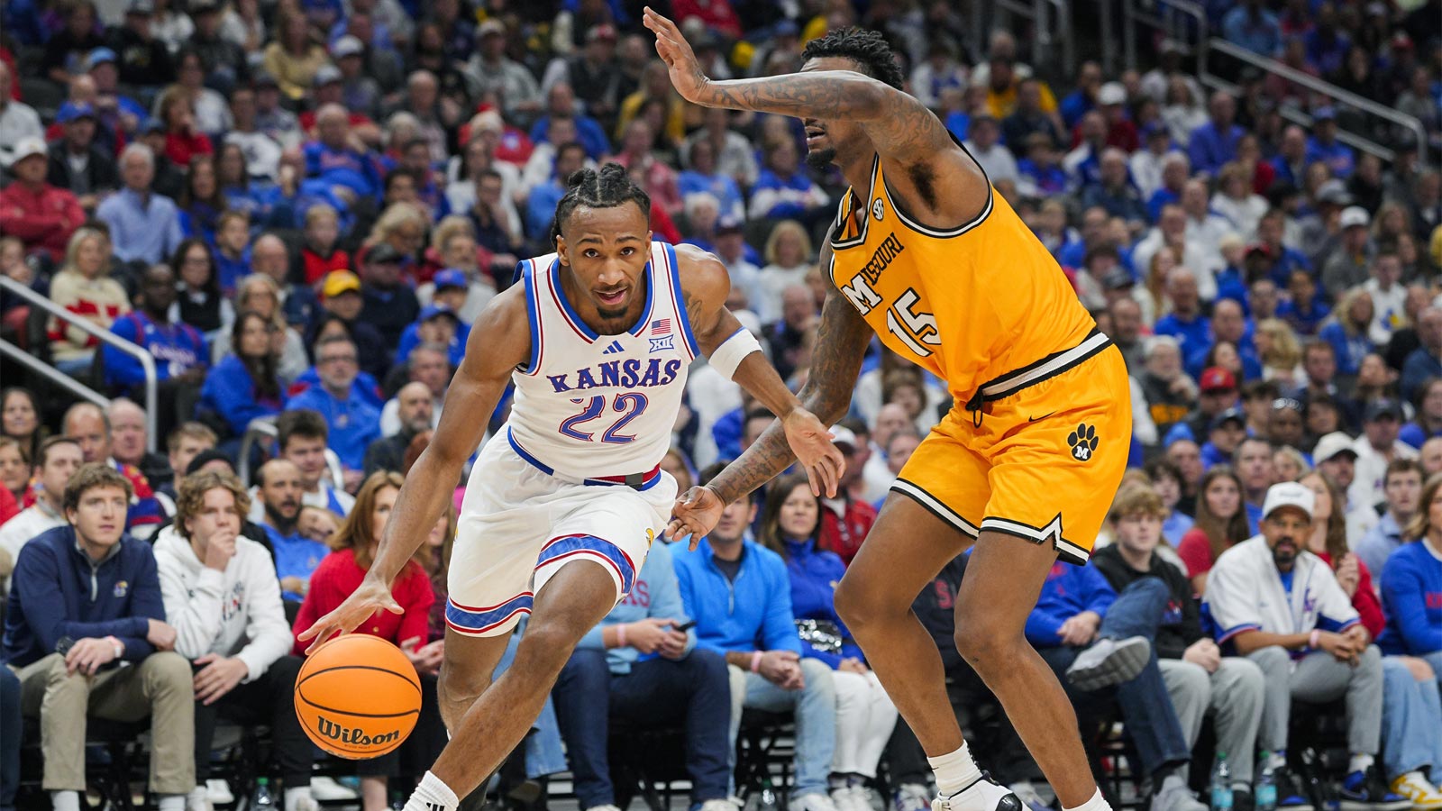 Kansas Jayhawks guard Darryn Peterson (22) drives against Missouri Tigers center Shawn Phillips Jr. (15) during the first half at T-Mobile Center.