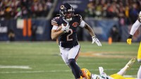 Chicago Bears wide receiver DJ Moore (2) runs after the catch against Green Bay Packers guard Lecitus Smith (68) during the first quarter at Soldier Field.