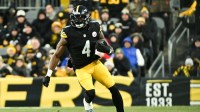 Pittsburgh Steelers wide receiver DK Metcalf (4) runs after making a catch during the first quarter against the Buffalo Bills at Acrisure Stadium.
