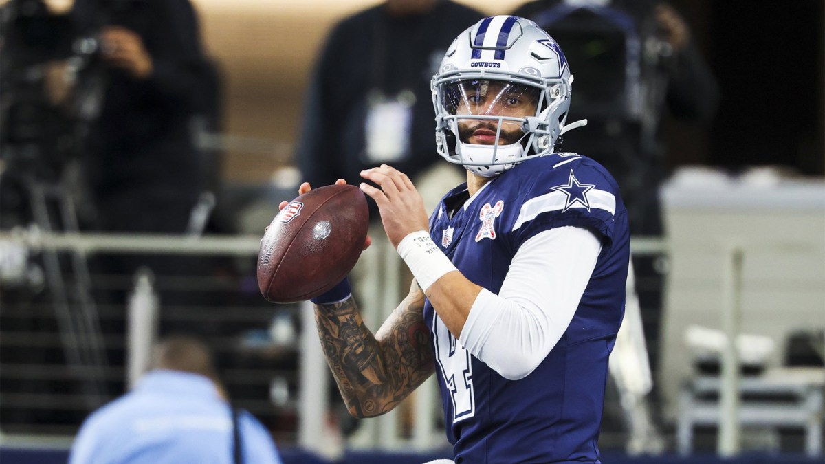 Dallas Cowboys quarterback Dak Prescott (4) participates in pregame warmups against the Los Angeles Chargers at AT&T Stadium.