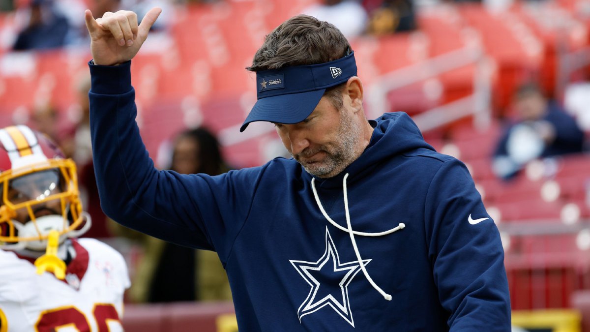 Dallas Cowboys head coach Brian Schottenheimer looks on during warmups before the game against the Washington Commanders at Northwest Stadium.