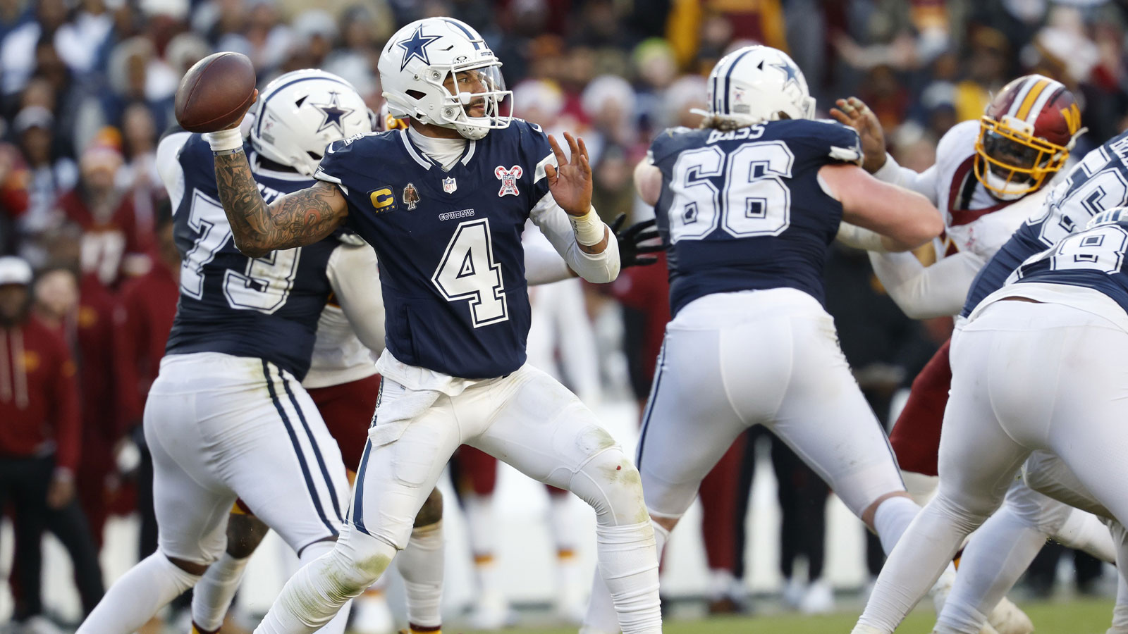 Dallas Cowboys quarterback Dak Prescott (4) passes the ball against the Washington Commanders during the second half at Northwest Stadium.