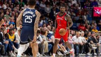 New Orleans Pelicans forward Zion Williamson (1) brings the ball up court against Dallas Mavericks forward P.J. Washington (25) during the second half at Smoothie King Center.