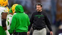 Oregon head coach Dan Lanning walks off the field after a timeout as the Oregon Ducks take on the Washington Huskies on Nov. 29, 2025, at Husky Stadium in Seattle, Washington.