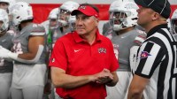 UNLV Rebels head coach Dan Mullen and his team prepare to take the field before a game against the Ohio Bobcats at the Ford Center at The Star.