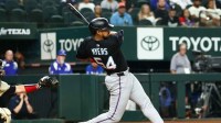 Miami Marlins center fielder Dane Myers (54) hits an rbi single during the twelfth inning against the Texas Rangers at Globe Life Field.