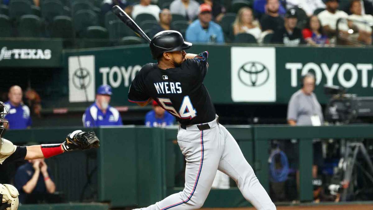 Miami Marlins center fielder Dane Myers (54) hits an rbi single during the twelfth inning against the Texas Rangers at Globe Life Field.