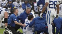 Indianapolis Colts quarterback Daniel Jones (17) is tended to by trainers after going down with an apparent injury against the Jacksonville Jaguars during the first half at EverBank Stadium.