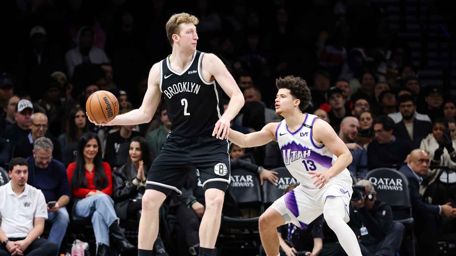 Brooklyn Nets forward Danny Wolf (2) looks to move the ball past Utah Jazz guard Walter Clayton Jr. (13) during the fourth quarter at Barclays Center.