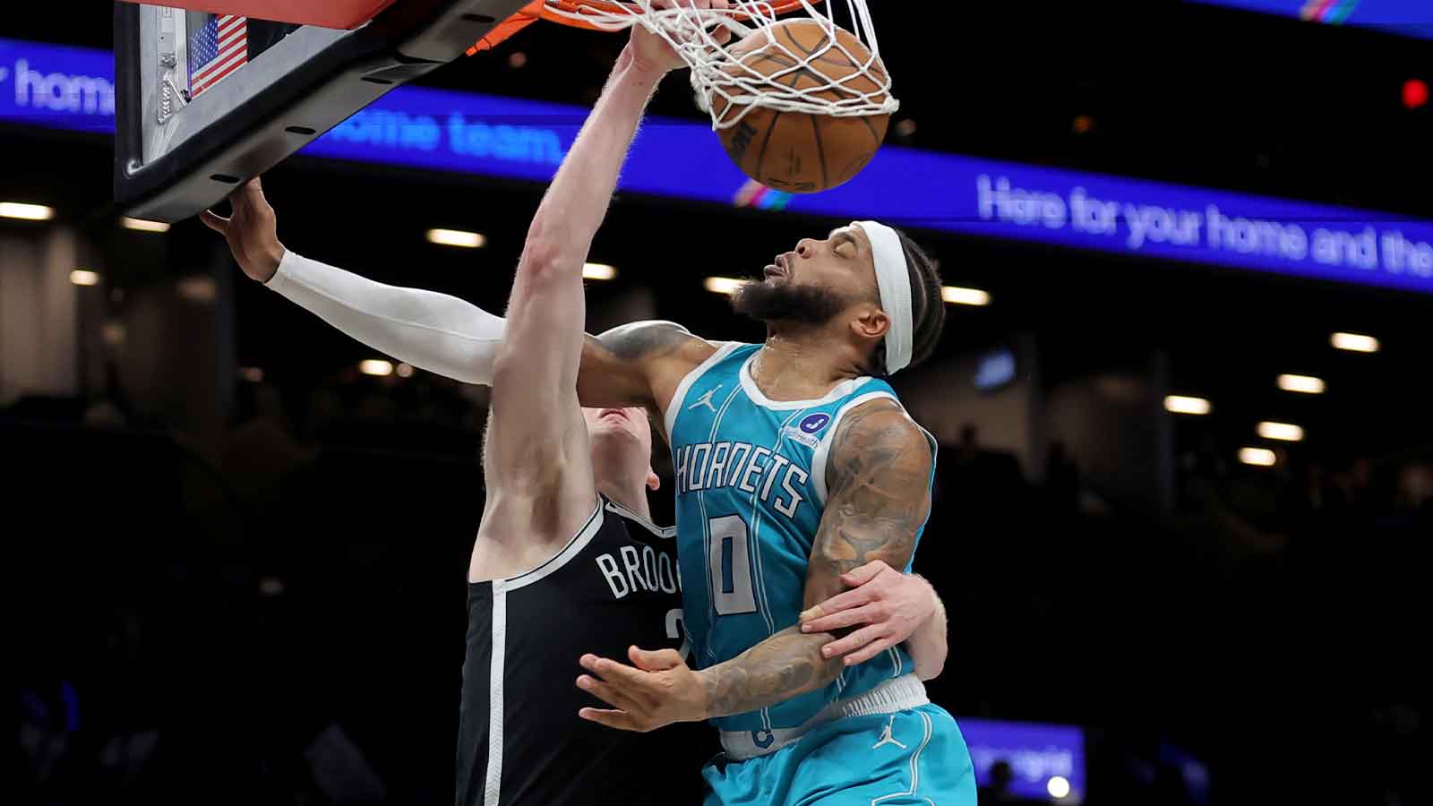 Brooklyn Nets forward Danny Wolf (2) dunks against Charlotte Hornets forward Miles Bridges (0) during the fourth quarter at Barclays Center.