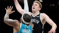 Brooklyn Nets forward Danny Wolf (2) dunks against Charlotte Hornets forward Miles Bridges (0) during the fourth quarter at Barclays Center.
