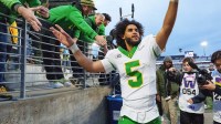 Oregon quarterback Dante Moore celebrates after the game as the Oregon Ducks take on the Washington Huskies on Nov. 29, 2025, at Husky Stadium in Seattle, Washington.