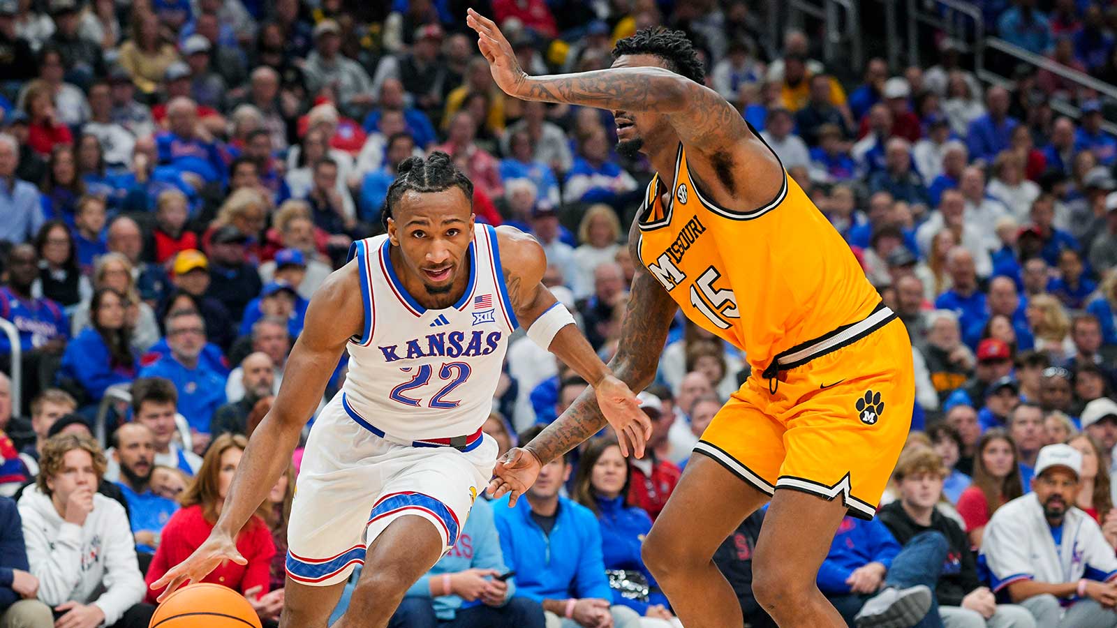 Kansas Jayhawks guard Darryn Peterson (22) drives against Missouri Tigers center Shawn Phillips Jr. (15) during the first half at T-Mobile Center. 