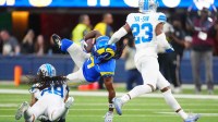 Detroit Lions cornerback Avonte Maddox (29) tackles Los Angeles Rams wide receiver Davante Adams (17) during the third quarter at SoFi Stadium.