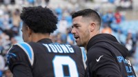Carolina Panthers head coach Dave Canales greets quarterback Bryce Young (9) after a win against the Tampa Bay Buccaneers at Bank of America Stadium.