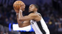 San Antonio Spurs guard De'Aaron Fox (4) shoots the ball against the Orlando Magic in the second quarter at Kia Center.