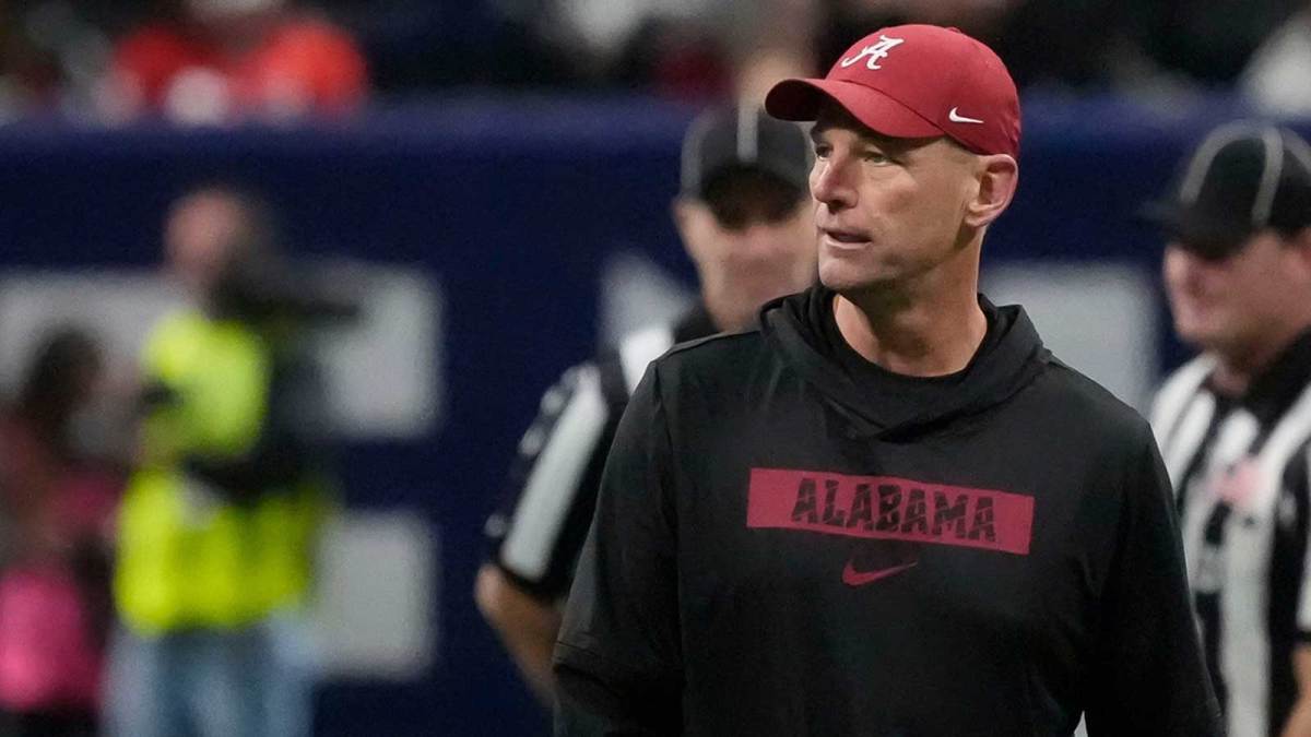 Alabama head coach Kalen DeBoer watches the Crimson Tide warm up before the SEC Championship Game at Mercedes-Benz Stadium.