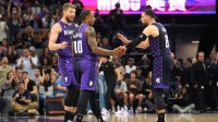 Sacramento Kings forward DeMar DeRozan (10) talks with forward Domantas Sabonis (left) and guard Zach LaVine (8) during the fourth quarter against the Los Angeles Clippers at Golden 1 Center.