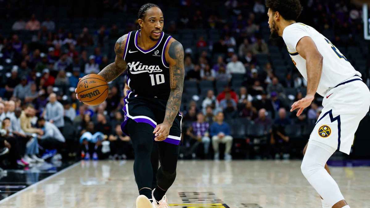 Sacramento Kings guard Demar Derozan (10) controls the ball during the first quarter against Denver Nuggets forward Cameron Johnson (23) at Golden 1 Center.