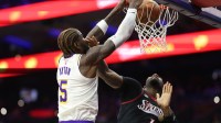 Los Angeles Lakers center Deandre Ayton (5) dunks past Philadelphia 76ers center Andre Drummond (1) during the first quarter at Xfinity Mobile Arena.