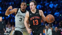 Dec 16, 2025; Las Vegas, Nevada, USA; New York Knicks guard Tyler Kolek (13) dribbles the ball against San Antonio Spurs forward Keldon Johnson (3) in the second half during the Emirates NBA Cup Final at T-Mobile Arena. Mandatory Credit: Kirby Lee-Imagn Images
