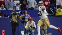 San Francisco 49ers linebacker Dee Winters (53) carries the ball after an interception for a touchdown against the Indianapolis Colts in the fourth quarter of the game at Lucas Oil Stadium.