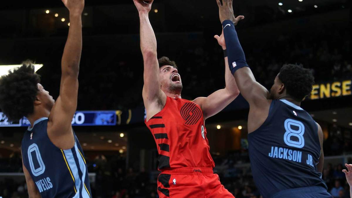 Portland Trail Blazers forward Deni Avdija (8) shoots as Memphis Grizzlies forward/center Jaren Jackson Jr. (8) defends during the second quarter at FedExForum.