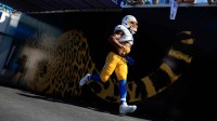 Los Angeles Chargers middle linebacker Denzel Perryman (6) enters the field before the first quarter of an NFL football game at EverBank Stadium, Sunday, Nov. 16, 2025 in Jacksonville, Fla. The Jacksonville Jaguars defeated the Los Angeles Chargers 35-6.