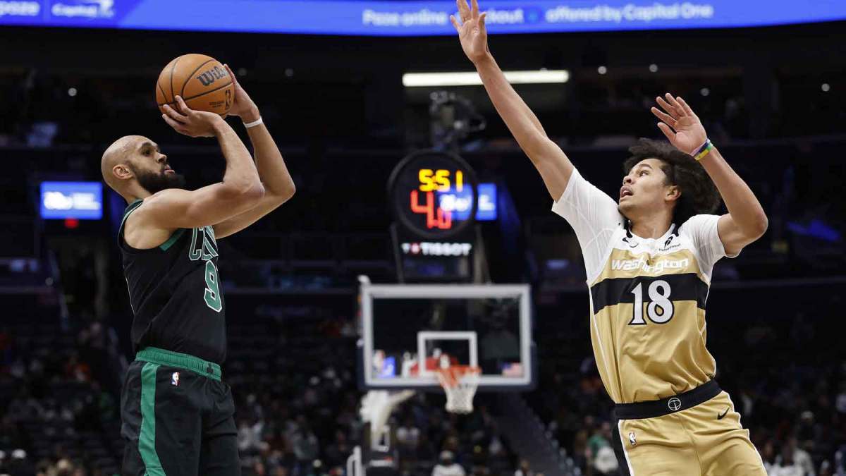 Boston Celtics guard Derrick White (9) shoots the ball as Washington Wizards forward Kyshawn George (18) defends in the first half at Capital One Arena.