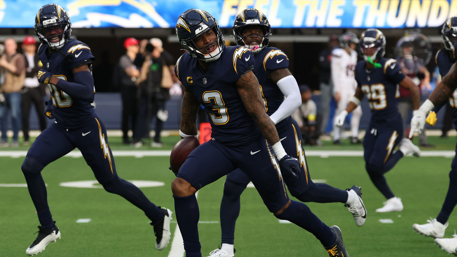 Los Angeles Chargers safety Derwin James Jr. (3) reacts with teammates after making an interception against the Houston Texans during the first half at SoFi Stadium. 