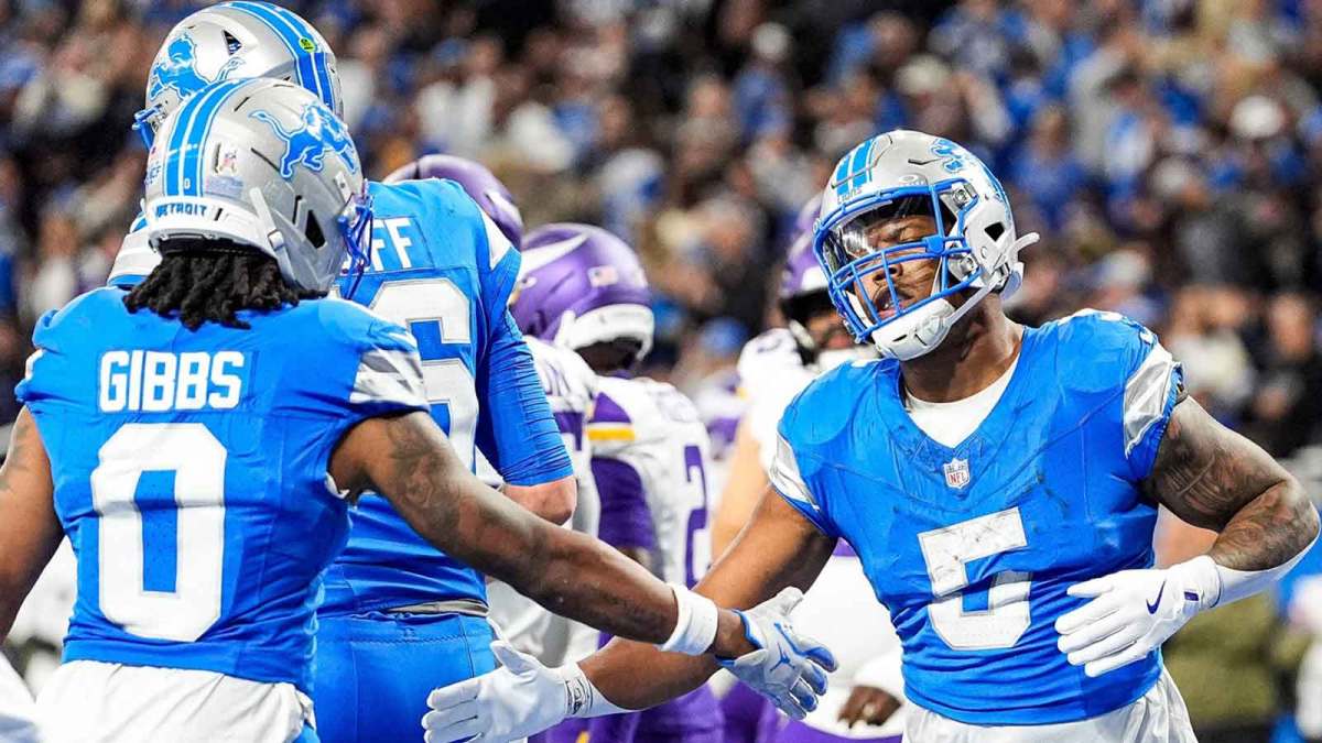 Detroit Lions running back David Montgomery (5) celebrates a touchdown against Minnesota Vikings with running back Jahmyr Gibbs (0) during the first half at Ford Field in Detroit on Sunday, November 2, 2025.
