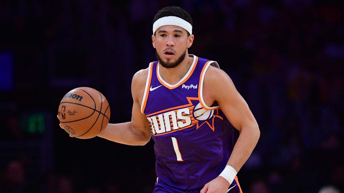 Phoenix Suns guard Devin Booker (1) moves the ball up court against the Los Angeles Lakers during the first half at Crypto.com Arena.