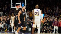 Phoenix Suns forward Dillon Brooks (3) and Los Angeles Lakers forward LeBron James (23) react during an altercation that resulted in a technical for Brooks during the second half of a game at at Mortgage Matchup Center.