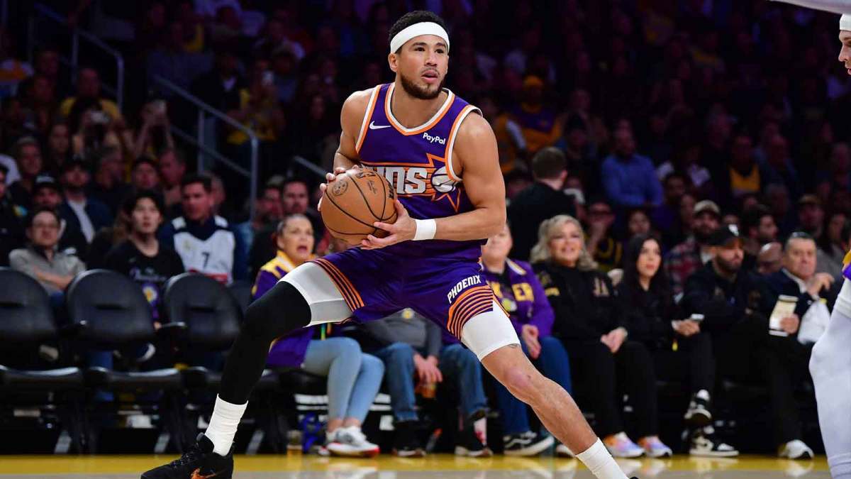 Phoenix Suns guard Devin Booker (1) controls the ball against the against the Los Angeles Lakers during the first half at Crypto.com Arena.