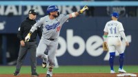 Los Angeles Dodgers second baseman Miguel Rojas (72) reacts after hitting a home run against the Toronto Blue Jays in the ninth inning for game seven of the 2025 MLB World Series at Rogers Centre.