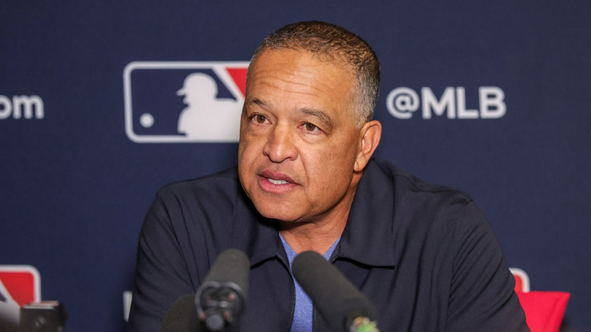Dave Roberts pushes back on MLB salary cap talk at the Winter Meetings, saying the Dodgers will adapt and dominate no matter the rules.