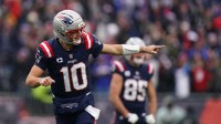 New England Patriots quarterback Drake Maye (10) reacts after a touchdown against the Buffalo Bills in the first half at Gillette Stadium.