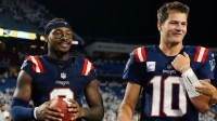 New England Patriots quarterback Drake Maye (10) and wide receiver Stefon Diggs (8) walks off the field against the Buffalo Bills after the game at Highmark Stadium.
